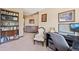 Charming home office with built in bookcase, desk, and sitting area at 3838 S Waco St, Aurora, CO 80013