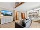 Open living space with second story access, seamlessly connecting to the dining area at 3838 S Waco St, Aurora, CO 80013