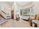 Airy living room featuring vaulted ceilings, lots of windows, and neutral decor at 3838 S Waco St, Aurora, CO 80013