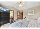 Comfortable main bedroom leads to ensuite bath; large window provides plenty of natural light at 3838 S Waco St, Aurora, CO 80013
