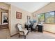 Comfortable home office featuring a large window for natural light and a functional workspace at 3838 S Waco St, Aurora, CO 80013
