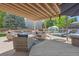 Spacious covered patio with seating, a lounging area and a trampoline at 3838 S Waco St, Aurora, CO 80013