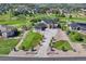 Aerial view of a sprawling estate with a circular driveway, lush landscaping, and a well-manicured lawn at 7343 Upton Ct, Castle Rock, CO 80104