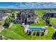 Expansive backyard featuring a swimming pool, patio with outdoor seating, and well-manicured lawn at 7343 Upton Ct, Castle Rock, CO 80104