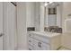 Well-lit bathroom with white cabinetry, modern fixtures, and quartz countertops at 7343 Upton Ct, Castle Rock, CO 80104
