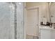 Sleek bathroom with a glass-enclosed shower featuring stylish tile work and modern fixtures at 7343 Upton Ct, Castle Rock, CO 80104