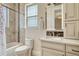 Bathroom featuring a shower-tub combo, and a large mirror over the vanity at 7343 Upton Ct, Castle Rock, CO 80104