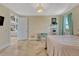 Bright bedroom featuring natural lighting and travertine floors, with view of the second floor at 7343 Upton Ct, Castle Rock, CO 80104