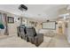 Home theater features reclining seats, a large projection screen, and moody lighting for a cinematic experience at 7343 Upton Ct, Castle Rock, CO 80104
