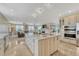 Open-concept kitchen features a sizable island, pendant lighting, and modern appliances at 7343 Upton Ct, Castle Rock, CO 80104