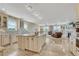 Bright kitchen with an island, stainless appliances, and tile backsplash open to a comfortable living area at 7343 Upton Ct, Castle Rock, CO 80104