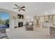 Open-concept living area with fireplace, tile flooring, and seamless flow to the kitchen at 7343 Upton Ct, Castle Rock, CO 80104