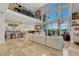 Bright living area featuring two-story windows, open layout, and stylish decor at 7343 Upton Ct, Castle Rock, CO 80104
