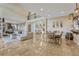 Expansive living room showcasing an open floor plan, high ceilings, and a seamless flow to the dining area at 7343 Upton Ct, Castle Rock, CO 80104