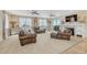 Comfortable living room with a fireplace, plush seating, and sliding door access to the outside at 7343 Upton Ct, Castle Rock, CO 80104