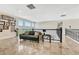 Comfortable loft featuring travertine floors and windows with natural lighting at 7343 Upton Ct, Castle Rock, CO 80104