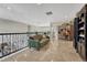 Bright loft featuring travertine floors, comfortable sofa, and natural lighting at 7343 Upton Ct, Castle Rock, CO 80104