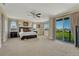 Spacious main bedroom featuring a ceiling fan, balcony access, and ample natural light at 7343 Upton Ct, Castle Rock, CO 80104