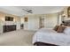 Bright and airy main bedroom with multiple doors, neutral colors, and soft carpet at 7343 Upton Ct, Castle Rock, CO 80104