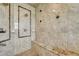 Detailed view of shower with a stone bench and patterned tile surround at 7343 Upton Ct, Castle Rock, CO 80104