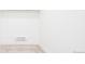 Bright empty bedroom, featuring neutral carpet, white walls, and baseboard heaters, ideal for personalization at 263 S Jackson St, Denver, CO 80209