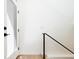 Bright entryway features a white door with black hardware and light wood flooring at 263 S Jackson St, Denver, CO 80209