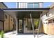 Contemporary home featuring a covered entry, steel beams, a metal roof, and modern architectural design at 263 S Jackson St, Denver, CO 80209