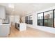 Open concept kitchen with modern gray cabinetry and stainless steel appliances at 263 S Jackson St, Denver, CO 80209