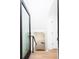 View down the bright stairway with black modern handrail to the lower floor at 263 S Jackson St, Denver, CO 80209