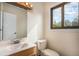 Bright bathroom with a window that provides natural light at 15623 Degaulle Cir, Brighton, CO 80603
