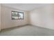 Bright bedroom with neutral walls, grey carpet and natural light from one window at 15623 Degaulle Cir, Brighton, CO 80603