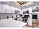 Newly remodeled kitchen, featuring white cabinets and stainless steel appliances at 8458 Everett Way # B, Arvada, CO 80005