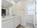 Modern bathroom with double vanity and a separate toilet area at 25022 E 34Th Pl, Aurora, CO 80019