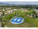 Overhead view of a public park with tennis courts, baseball fields, and a playground at 7081 Salvia St, Arvada, CO 80007