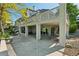 Backyard patio with overhead coverage and a lush, green landscape, offering a tranquil outdoor space at 7081 Salvia St, Arvada, CO 80007