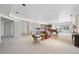 Open basement area featuring plush carpet, wet bar, and ample space for entertaining at 7081 Salvia St, Arvada, CO 80007