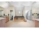 Luxurious primary bathroom with a soaking tub, separate shower, and dual vanities, offering a spa-like experience at 7081 Salvia St, Arvada, CO 80007
