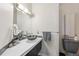 Modern bathroom featuring a unique glass sink and stylish decor at 7081 Salvia St, Arvada, CO 80007