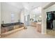 Bathroom featuring a sunken tub, separate shower, and closet at 7081 Salvia St, Arvada, CO 80007