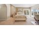 Bright bedroom featuring a comfortable bed and a sliding door to the deck at 7081 Salvia St, Arvada, CO 80007