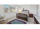 Bedroom with a golf theme, large windows, and carpet floors at 7081 Salvia St, Arvada, CO 80007