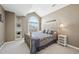 Bedroom featuring a large window and neutral decor at 7081 Salvia St, Arvada, CO 80007