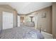 Spacious bedroom featuring neutral paint, carpet and an ensuite bathroom at 7081 Salvia St, Arvada, CO 80007