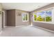 Bright bedroom with large windows offering scenic outdoor views and neutral carpet at 7081 Salvia St, Arvada, CO 80007