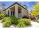 Beautiful exterior of home, showcasing mature landscaping and covered front porch at 7081 Salvia St, Arvada, CO 80007