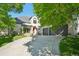 Beautiful two-story home with a well-maintained front yard and a spacious driveway leading to the garage at 7081 Salvia St, Arvada, CO 80007