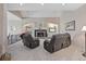 Upstairs living room with built-in features and a cozy fireplace to create an inviting and relaxed atmosphere at 7081 Salvia St, Arvada, CO 80007