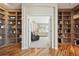 View into main bedroom from between two built-in bookshelves, creating a cozy and private retreat at 7081 Salvia St, Arvada, CO 80007