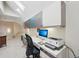 Bright office space with built-in desk, storage, and natural light from a skylight at 7081 Salvia St, Arvada, CO 80007