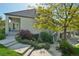 Back exterior with a walkout basement, deck, and landscaped backyard, combining indoor-outdoor living seamlessly at 7081 Salvia St, Arvada, CO 80007